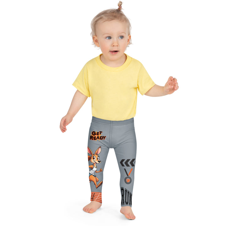  Track Runner Kangaroo Girls Leggings, dark gray background with a sporty kangaroo running on an orange track on one leg, "get ready" text in black and orange above, and an orange and black medal with "runner" text in the lower corner on the other leg, front close-up view on model