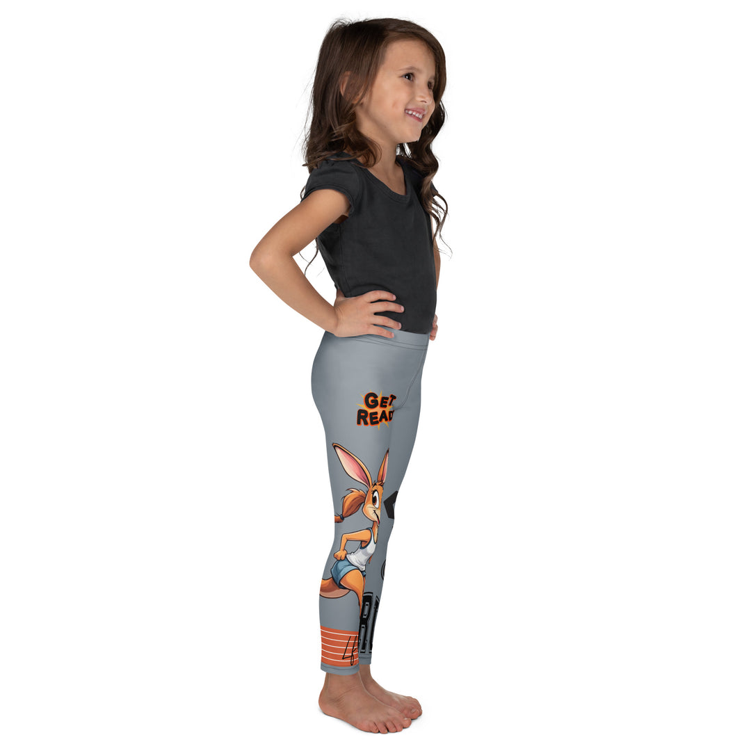  Track Runner Kangaroo Girls Leggings, dark gray background with a sporty kangaroo running on an orange track on one leg, "get ready" text in black and orange above, and an orange and black medal with "runner" text in the lower corner on the other leg, right side view on model
