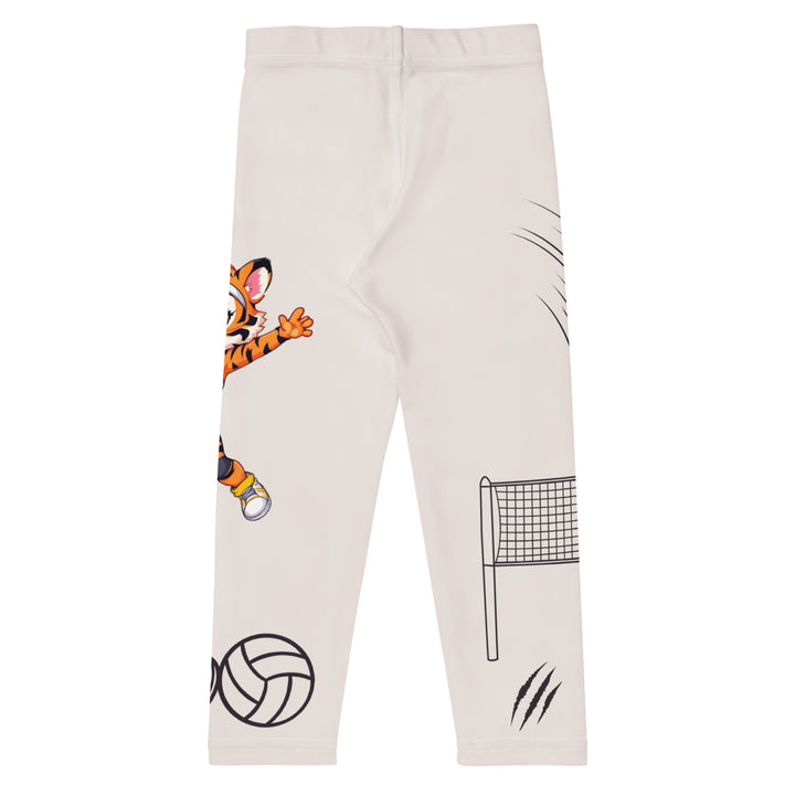 Volley Queen Tiger Girls Leggings, beige background with one leg featuring a sporty dressed tiger holding a volleyball, and the other leg with a volleyball net and a ball leaving a motion trail, back view.