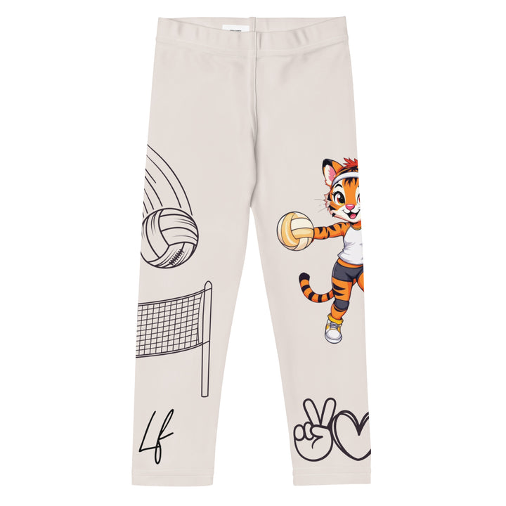 Volley Queen Tiger Girls Leggings, beige background with one leg featuring a sporty dressed tiger holding a volleyball, and the other leg with a volleyball net and a ball leaving a motion trail, front view
