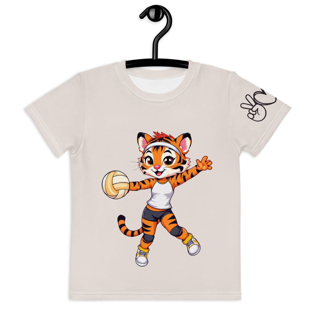 Volley Queen Tiger Girls T-shirt, beige background with a sporty dressed tiger holding a volleyball on the front, a heart, volleyball, and peace sign on the left sleeve, and a volleyball net with a ball leaving a motion trail on the back, front view on hanger