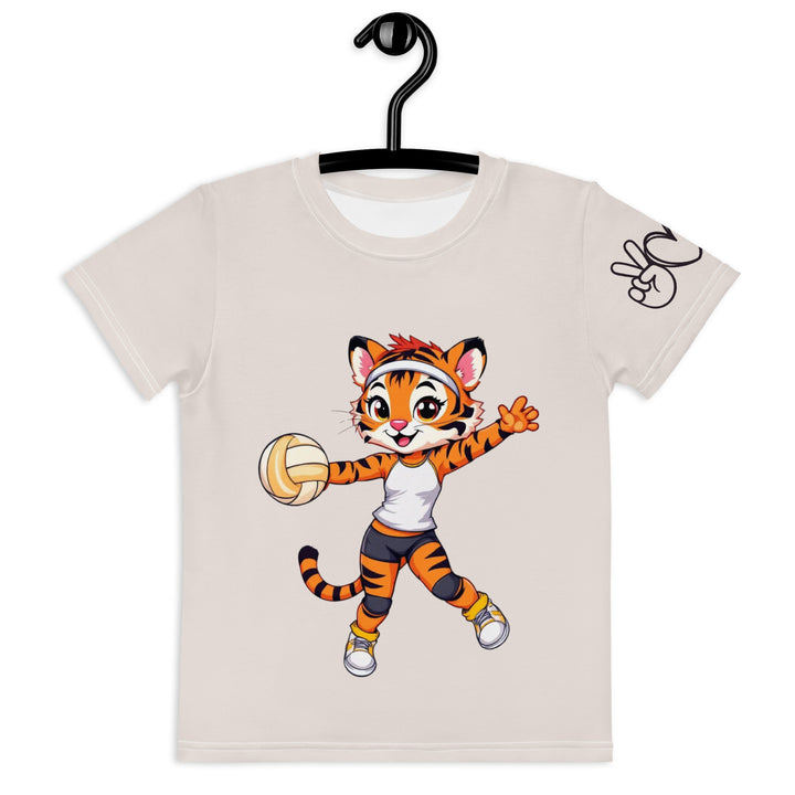 Volley Queen Tiger Girls T-shirt, beige background with a sporty dressed tiger holding a volleyball on the front, a heart, volleyball, and peace sign on the left sleeve, and a volleyball net with a ball leaving a motion trail on the back, front view on hanger