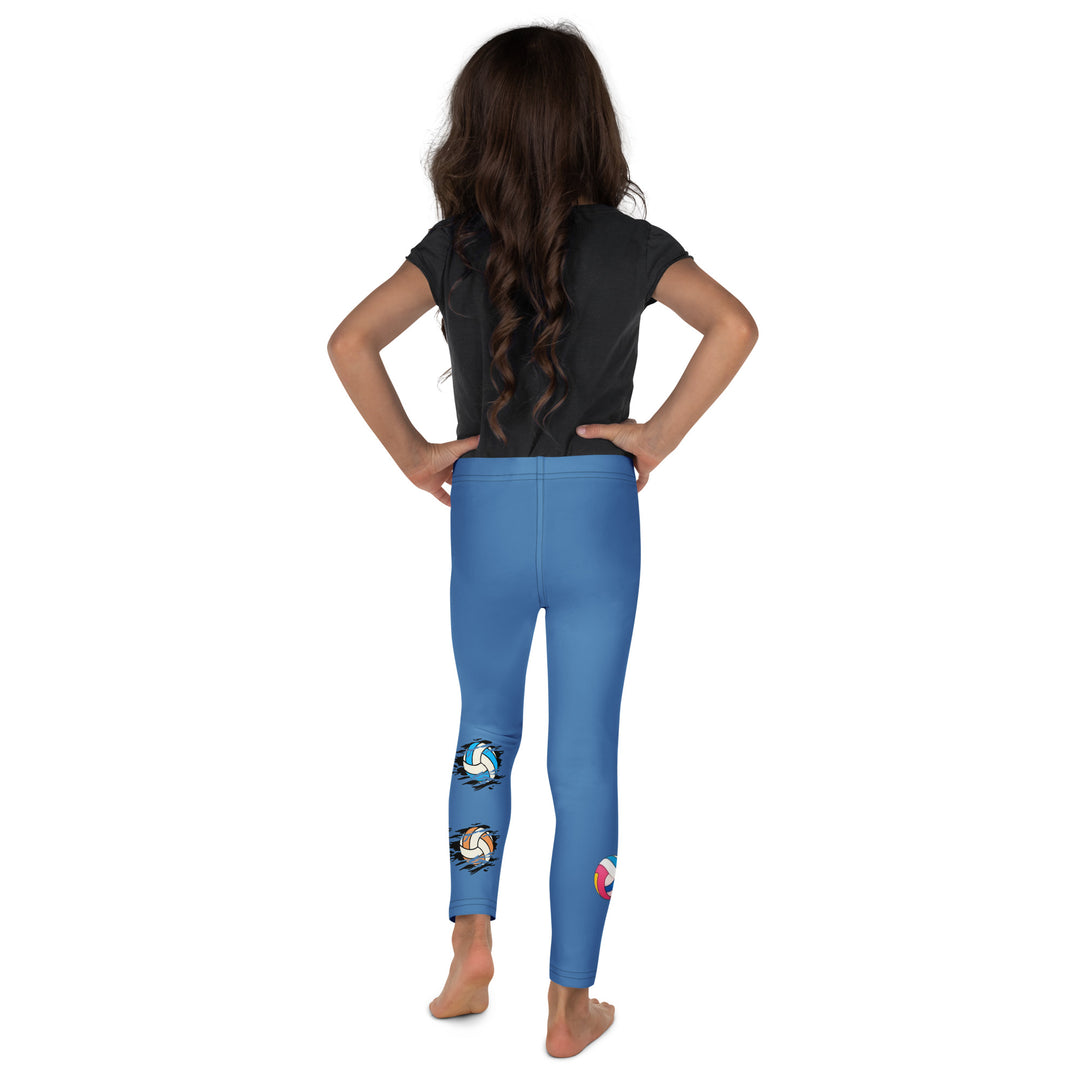  Volleyball Tiger Girls Leggings, blue background with a sporty dressed tiger holding a volleyball on one leg, and colorful glowing volleyballs on the other leg, back view on model