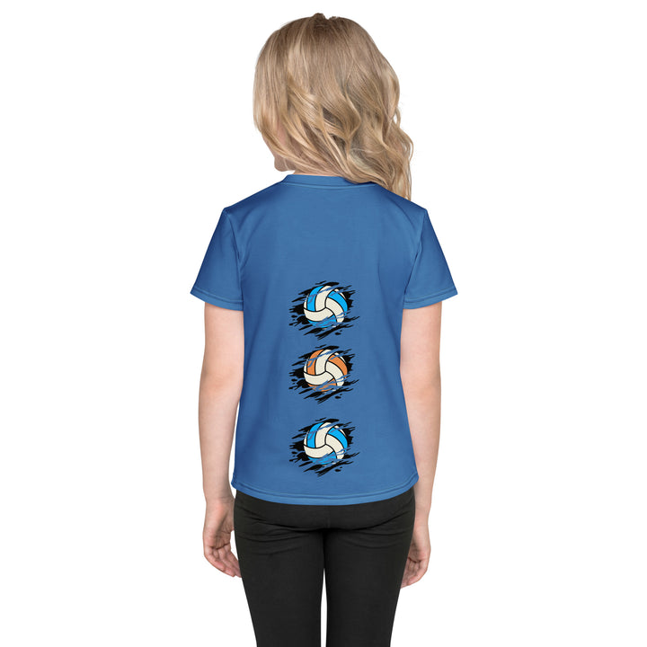 Volleyball Tiger Girls T-shirt, blue background with a sporty dressed tiger holding a volleyball on the front, and colorful glowing volleyballs on the back, back view on model