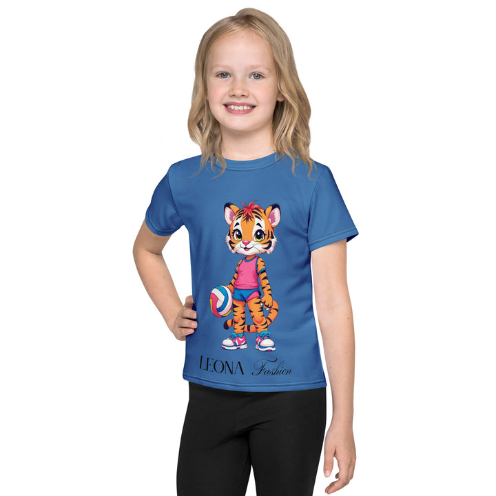  Volleyball Tiger Girls T-shirt, blue background with a sporty dressed tiger holding a volleyball on the front, and colorful glowing volleyballs on the back, front view on model-with a visible 'Leona Fashion' text on the design