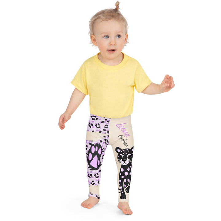 Wild Kitty Paw Purple Girls Leggings, cream background with a black panther featuring soft lavender spots on one leg, and a black and lavender tiger-striped pattern with a large matching paw on the other leg, mixed with cream details, front close-up view on model-with a visible 'Leona Fashion' text on the design