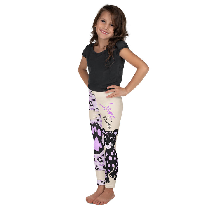 Wild Kitty Paw Purple Girls Leggings, cream background with a black panther featuring soft lavender spots on one leg, and a black and lavender tiger-striped pattern with a large matching paw on the other leg, mixed with cream details, left side view on model-with a visible 'Leona Fashion' text on the design