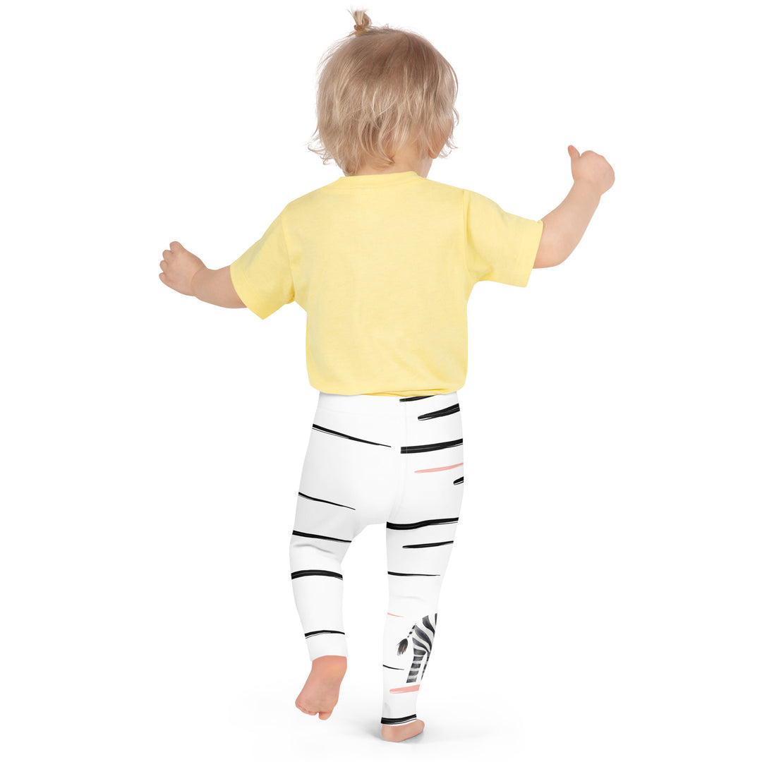 Zebra Blush Glow Girls Leggings, back view, white with black and white zebra print and blush pink stripes, shown on model