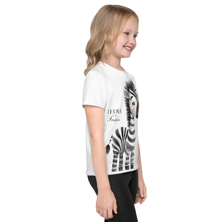 Zebra Blush Glow Girls T-shirt, white with black and white zebra print, side angle shown on model-with a visible 'Leona Fashion' text on the design
